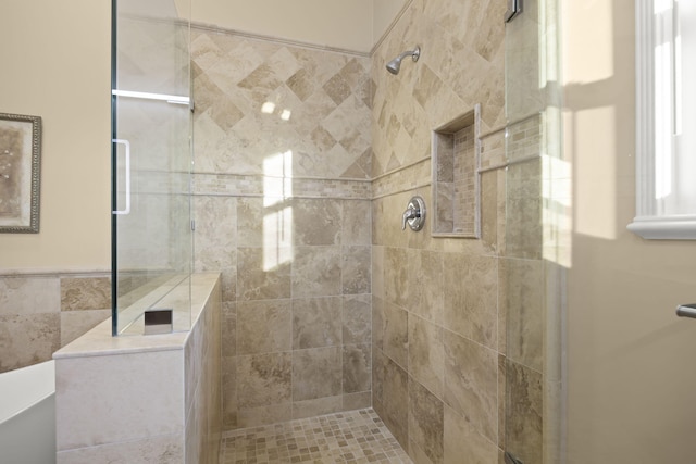 bathroom featuring tiled shower