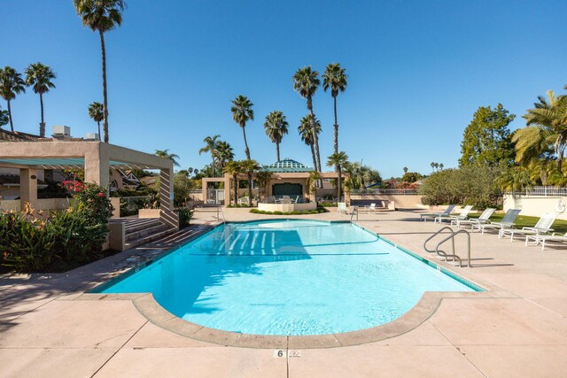 view of swimming pool with a gazebo and a patio