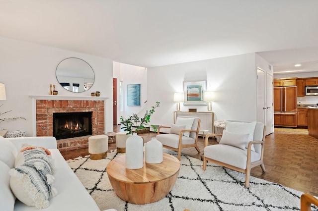 living room with light parquet flooring and a fireplace