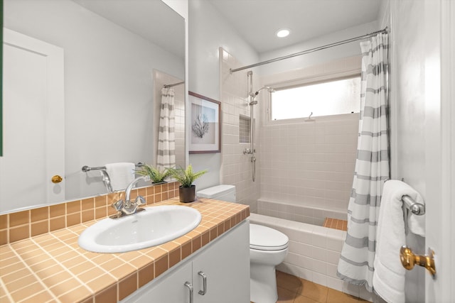 full bathroom featuring shower / bath combo, vanity, toilet, and tile patterned floors