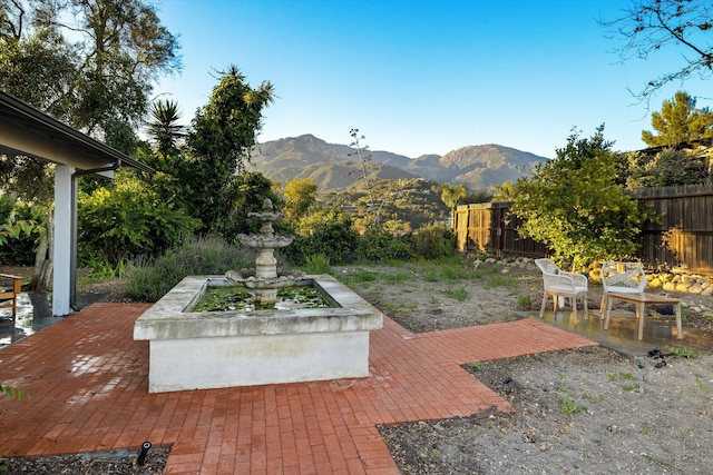 view of patio / terrace featuring a mountain view