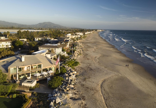 birds eye view of property with a view of the beach and a water view