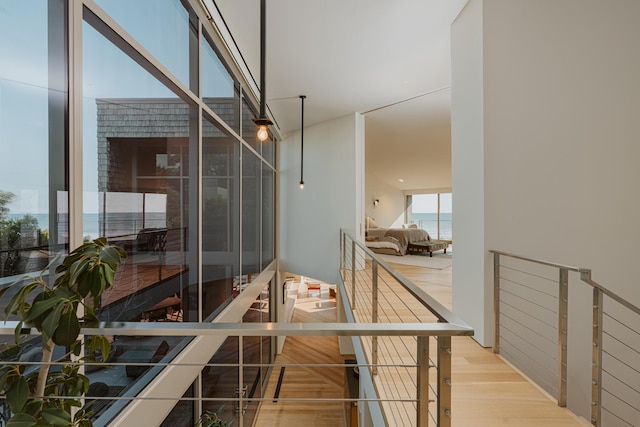 interior space featuring a water view and light hardwood / wood-style flooring