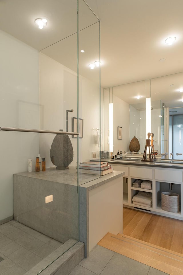 bathroom featuring tile patterned flooring and vanity