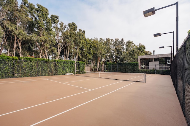 view of tennis court featuring basketball court