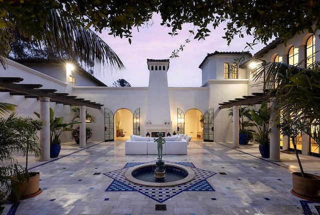 patio terrace at dusk with outdoor lounge area