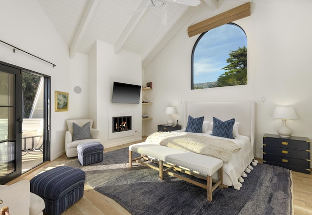 bedroom with ceiling fan, high vaulted ceiling, beamed ceiling, and light wood-type flooring