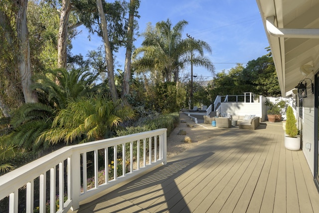 deck featuring outdoor lounge area