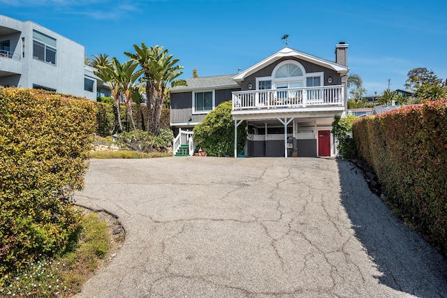 view of front of property with a carport