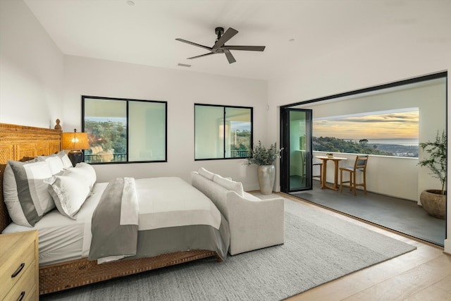 bedroom with visible vents, ceiling fan, and wood finished floors