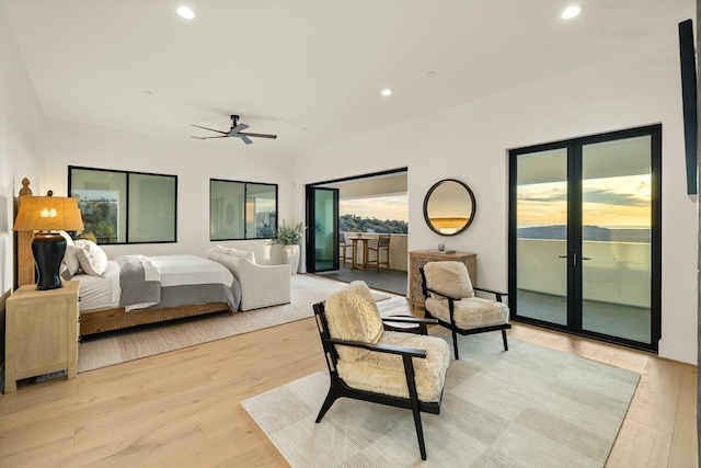 bedroom with access to outside, french doors, recessed lighting, and light wood-style floors