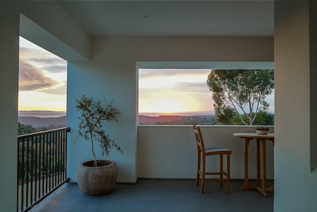 view of balcony at dusk