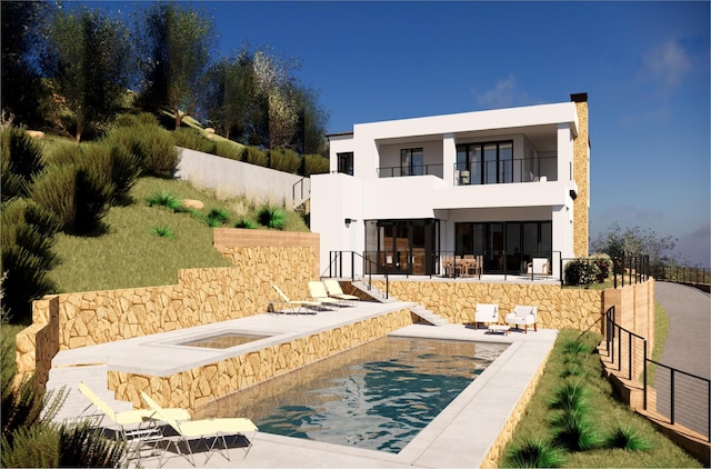 back of house with a balcony, a jacuzzi, fence, a pool, and stucco siding