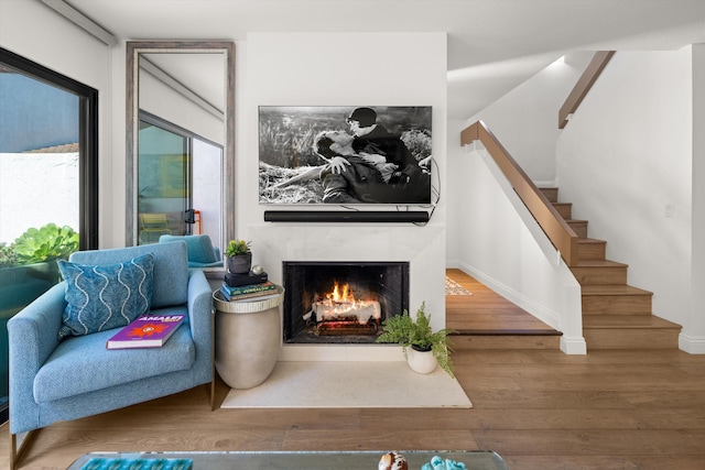 sitting room featuring hardwood / wood-style floors