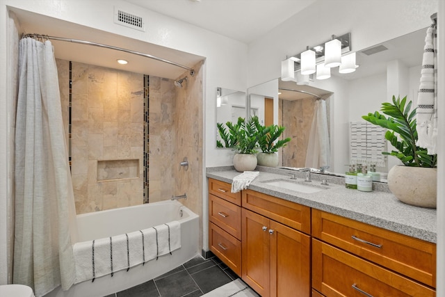 bathroom with tile patterned floors, vanity, and shower / bathtub combination with curtain