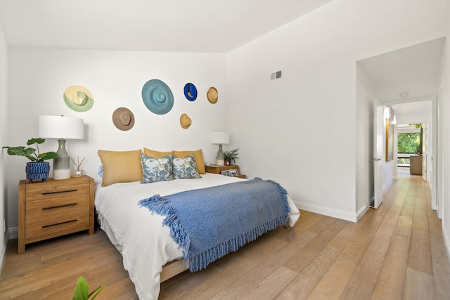 bedroom with wood-type flooring