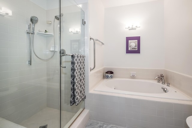 bathroom with shower with separate bathtub