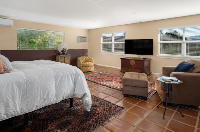 tiled bedroom featuring a wall mounted AC and multiple windows