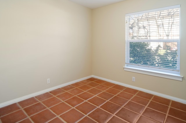 empty room with tile patterned flooring