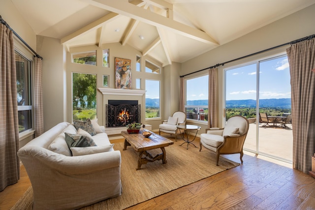 2408 Latigo Dr, Solvang, CA 93463 - living room featuring vaulted ceiling with beams, a mountain view, and hardwood / wood-style flooring
