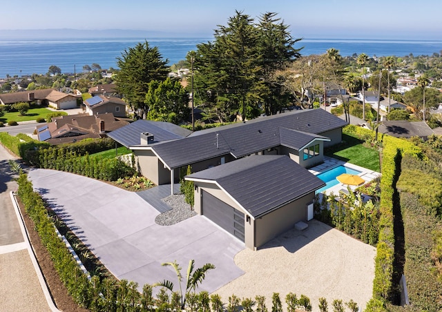 bird's eye view featuring a residential view and a water view