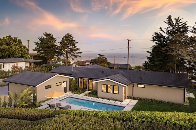 outdoor pool featuring a patio