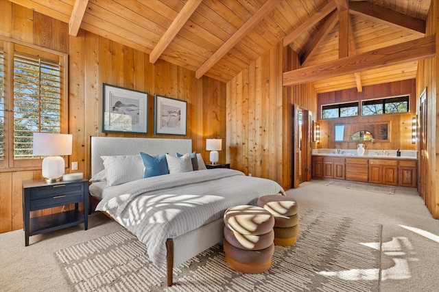 carpeted bedroom featuring wood walls, high vaulted ceiling, connected bathroom, beam ceiling, and wood ceiling