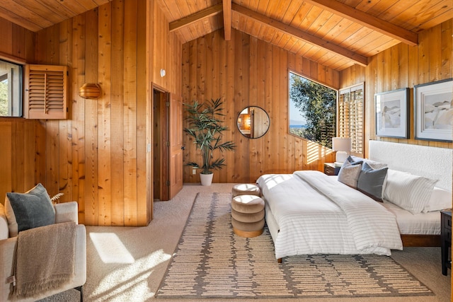 carpeted bedroom with vaulted ceiling with beams, wood walls, and wooden ceiling