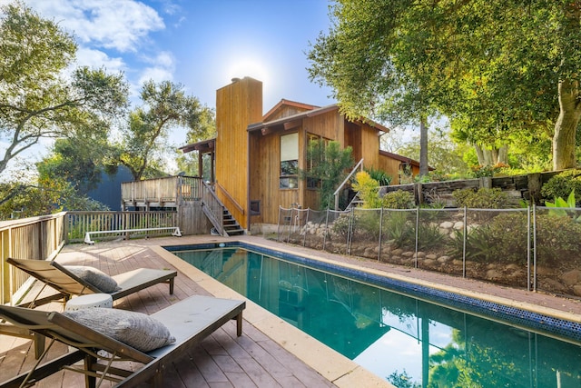 view of swimming pool featuring a wooden deck