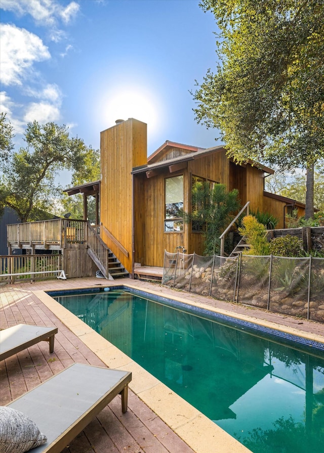 view of pool with a wooden deck