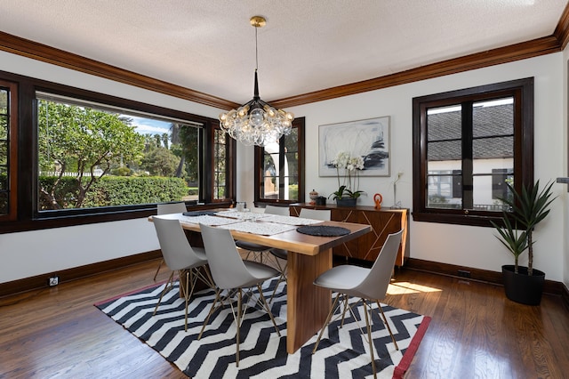 dining space featuring crown molding, plenty of natural light, a textured ceiling, and dark hardwood / wood-style flooring