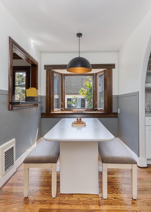 unfurnished dining area with breakfast area and light wood-type flooring