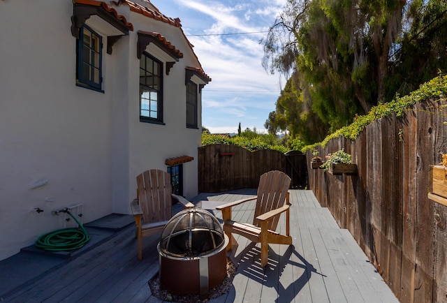 deck with an outdoor fire pit