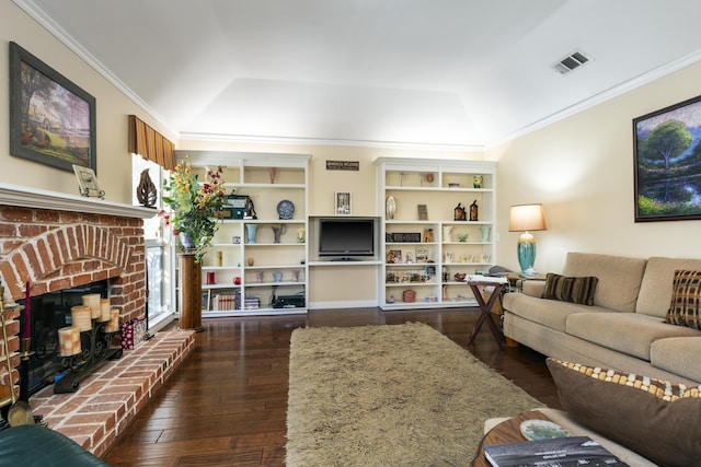 living room with a fireplace, dark hardwood / wood-style flooring, lofted ceiling, and crown molding