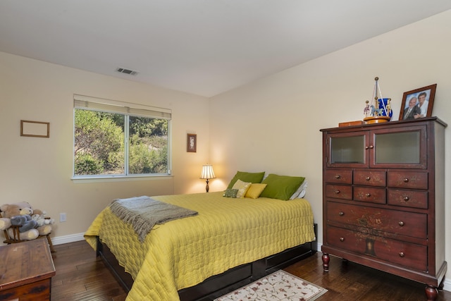 bedroom featuring dark hardwood / wood-style flooring