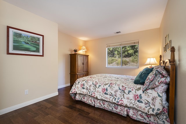 bedroom featuring dark hardwood / wood-style floors