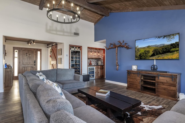 living room with an inviting chandelier, a barn door, dark hardwood / wood-style flooring, wood ceiling, and beverage cooler