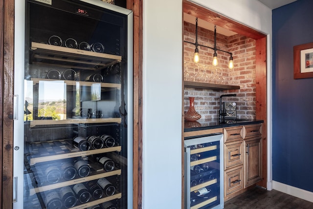 bar featuring dark hardwood / wood-style flooring and wine cooler