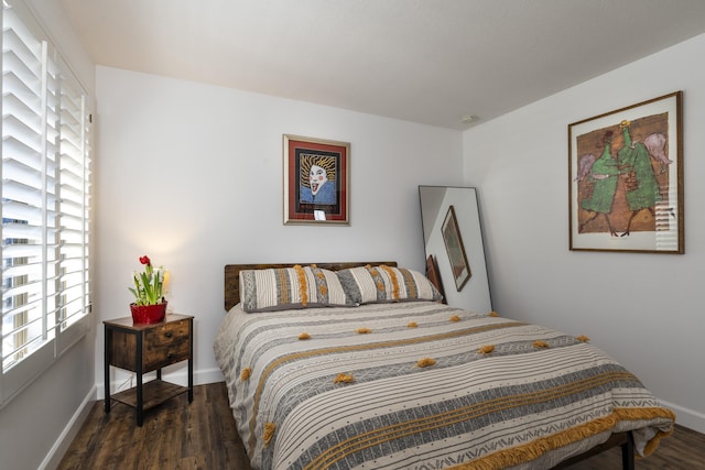 bedroom featuring dark hardwood / wood-style flooring