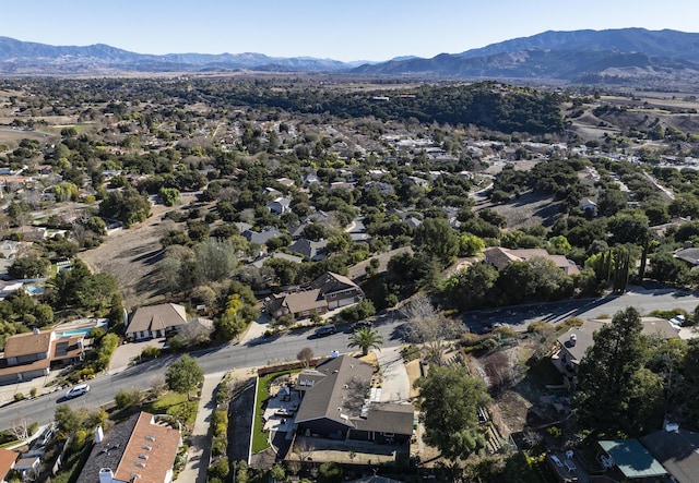 birds eye view of property with a mountain view