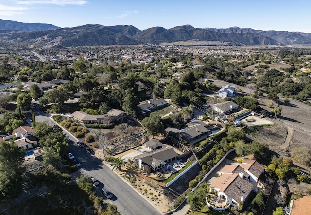 birds eye view of property featuring a mountain view