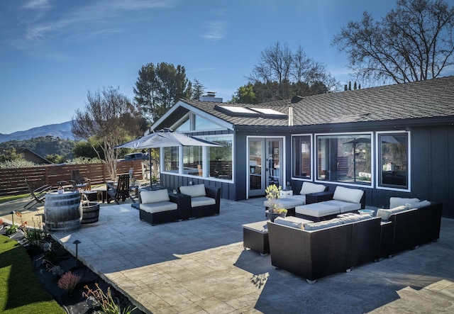 view of patio featuring outdoor lounge area and a mountain view