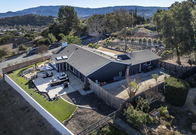 birds eye view of property with a mountain view