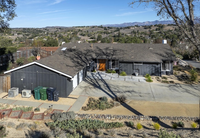 view of front facade featuring a mountain view and a garage