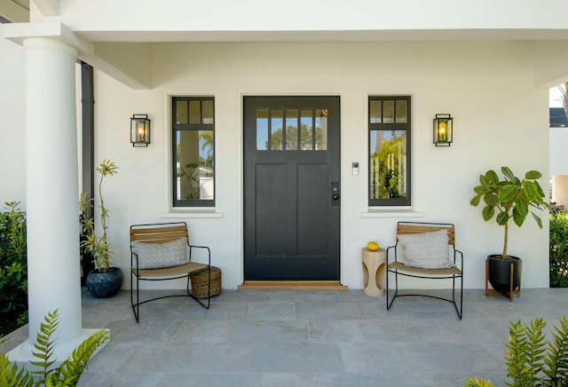 property entrance featuring covered porch