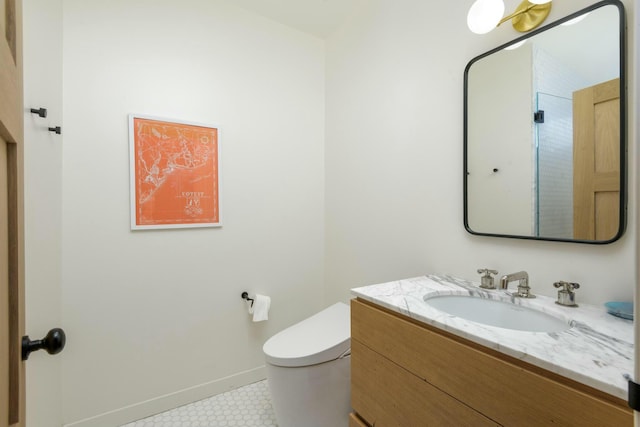 bathroom featuring vanity and toilet