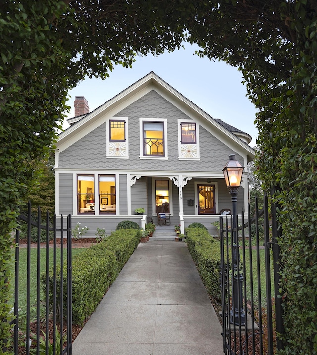 view of front of home featuring a front lawn and a porch