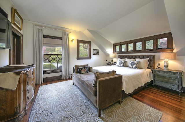 bedroom with lofted ceiling and hardwood / wood-style flooring