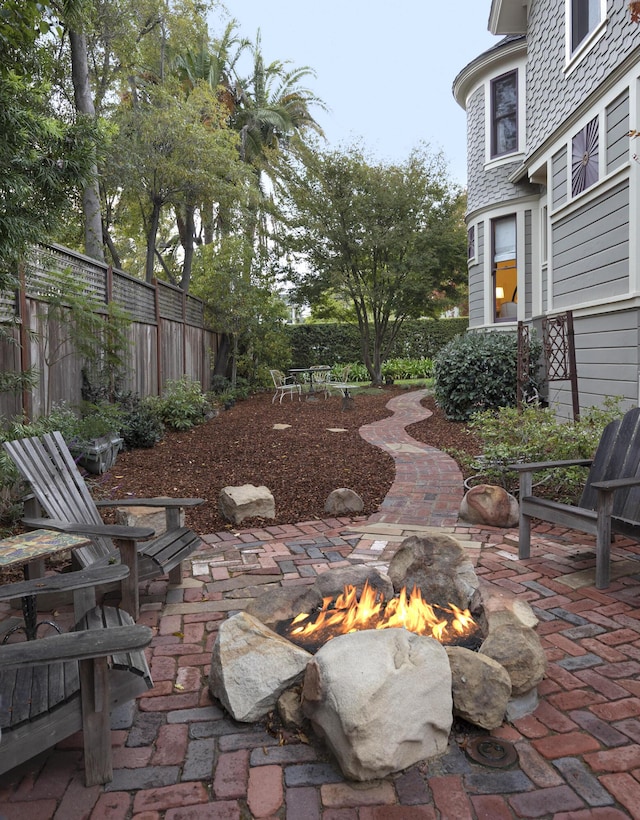 view of patio with an outdoor fire pit