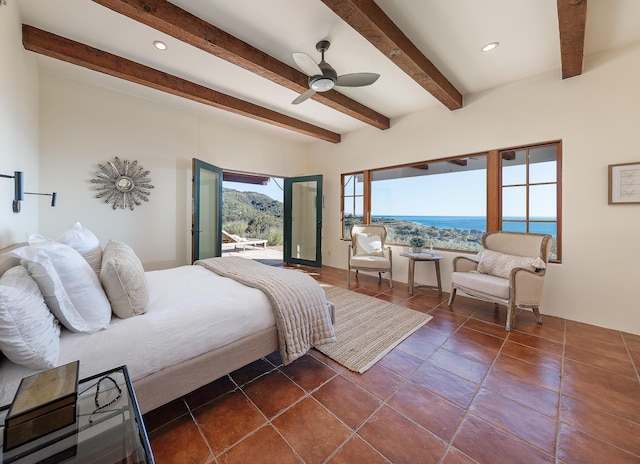 bedroom with a water view, ceiling fan, access to exterior, dark tile patterned floors, and beam ceiling